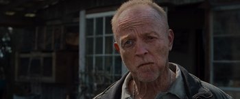 Movie still from “The Cabin in the Woods” (2011), directed by Drew Goddard – An older man with a beard and a mustache; Close Up shot, Low angle