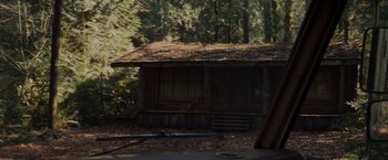 Movie still from “The Cabin in the Woods” (2011), directed by Drew Goddard – An old log cabin in the middle of the woods; Wide shot, High angle
