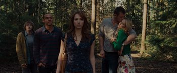 Movie still from “The Cabin in the Woods” (2011), directed by Drew Goddard – A group of people standing in the woods; Medium shot, Over the shoulder angle