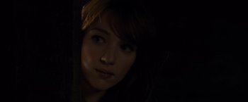 Movie still from “The Cabin in the Woods” (2011), directed by Drew Goddard – A young woman is looking into the camera; Close Up shot, Over the shoulder angle