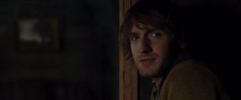 Movie still from “The Cabin in the Woods” (2011), directed by Drew Goddard – A person with long brown hair; Close Up shot, Over the shoulder angle