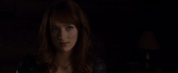 Movie still from “The Cabin in the Woods” (2011), directed by Drew Goddard – A beautiful young woman with long red hair and blue eyes; Close Up shot, Over the shoulder angle