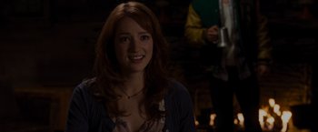 Movie still from “The Cabin in the Woods” (2011), directed by Drew Goddard – A beautiful young lady smiling for the camera; Close Up shot, Over the shoulder angle