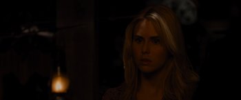 Movie still from “The Cabin in the Woods” (2011), directed by Drew Goddard – A beautiful blonde haired woman in the dark; Close Up shot, Over the shoulder angle