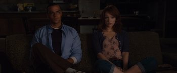 Movie still from “The Cabin in the Woods” (2011), directed by Drew Goddard – A man and a woman sitting next to each other on a couch; Medium shot, Over the shoulder angle