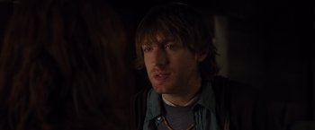 Movie still from “The Cabin in the Woods” (2011), directed by Drew Goddard – A person wearing a shirt; Close Up shot, Over the shoulder angle