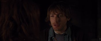 Movie still from “The Cabin in the Woods” (2011), directed by Drew Goddard – A person wearing a jacket; Close Up shot, Over the shoulder angle