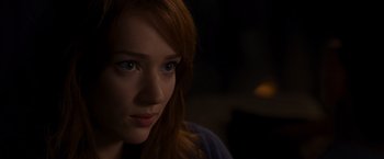Movie still from “The Cabin in the Woods” (2011), directed by Drew Goddard – A person with long red hair; Close Up shot, Over the shoulder angle