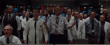 Movie still from “The Cabin in the Woods” (2011), directed by Drew Goddard – A group of men in white lab coats standing in front of a computer; Medium shot, Low angle