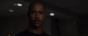 Movie still from “The Cabin in the Woods” (2011), directed by Drew Goddard – A person with a mustache; Close Up shot, Over the shoulder angle