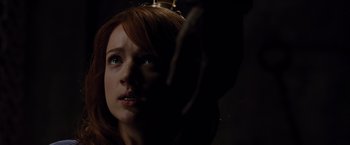 Movie still from “The Cabin in the Woods” (2011), directed by Drew Goddard – A woman with red hair is looking up at the ceiling; Close Up shot, Low angle