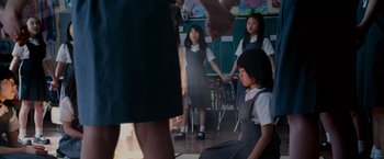 Movie still from “The Cabin in the Woods” (2011), directed by Drew Goddard – A group of young girls standing in front of a teacher; Wide shot, High angle