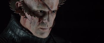 Movie still from “The Cabin in the Woods” (2011), directed by Drew Goddard – A person wearing a costume; Close Up shot, Overhead angle