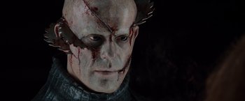 Movie still from “The Cabin in the Woods” (2011), directed by Drew Goddard – A man's face with blood on his face; Close Up shot, Over the shoulder angle