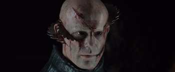 Movie still from “The Cabin in the Woods” (2011), directed by Drew Goddard – A man's face with blood on his face; Close Up shot, Low angle