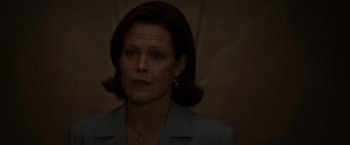 Movie still from “The Cabin in the Woods” (2011), directed by Drew Goddard – A person wearing a suit; Close Up shot, Low angle