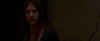 Movie still from “The Cabin in the Woods” (2011), directed by Drew Goddard – A person with a bloody face; Close Up shot, Over the shoulder angle