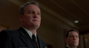 Movie still from “The Caine Mutiny Court-Martial” (2023), directed by William Friedkin – A man in a suit and a tie; Close Up shot, Low angle