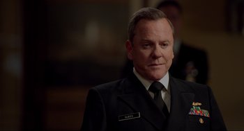 Movie still from “The Caine Mutiny Court-Martial” (2023), directed by William Friedkin – A man in a suit and tie; Close Up shot, Over the shoulder angle