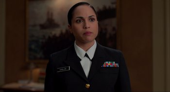 Movie still from “The Caine Mutiny Court-Martial” (2023), directed by William Friedkin – A woman in a military uniform is looking at the camera; Close Up shot, Over the shoulder angle