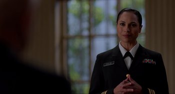 Movie still from “The Caine Mutiny Court-Martial” (2023), directed by William Friedkin – A woman in a military uniform is holding a pen; Close Up shot, Over the shoulder angle