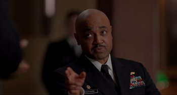 Movie still from “The Caine Mutiny Court-Martial” (2023), directed by William Friedkin – A man in a military uniform is looking at the camera; Close Up shot, Over the shoulder angle