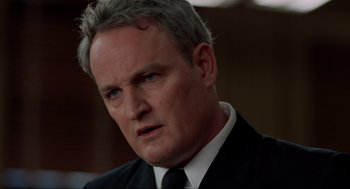 Movie still from “The Caine Mutiny Court-Martial” (2023), directed by William Friedkin – A man in a black suit and a black tie; Close Up shot, Low angle