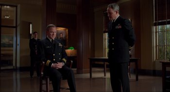 Movie still from “The Caine Mutiny Court-Martial” (2023), directed by William Friedkin – Two men in military uniforms are sitting in a room; Medium shot, Over the shoulder angle