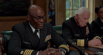 Movie still from “The Caine Mutiny Court-Martial” (2023), directed by William Friedkin – Two men in military uniforms sitting at a table; Close Up shot, Over the shoulder angle