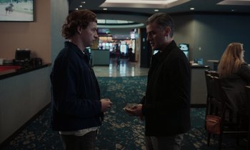 Movie still from “The Card Counter” (2021), directed by Paul Schrader – Two men standing next to each other in a room; Medium shot, Over the shoulder angle