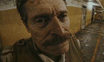 Movie still from “The Card Counter” (2021), directed by Paul Schrader – An old man with a mustache and a beard; Close Up shot, Low angle