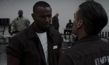 Movie still from “The Card Counter” (2021), directed by Paul Schrader – Two men are talking to each other in a room; Close Up shot, Over the shoulder angle