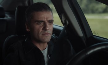 Movie still from “The Card Counter” (2021), directed by Paul Schrader – A person sitting in a car; Close Up shot, Over the shoulder angle