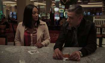 Movie still from “The Card Counter” (2021), directed by Paul Schrader – A man and a woman sitting at a table; Medium shot, Over the shoulder angle