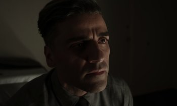 Movie still from “The Card Counter” (2021), directed by Paul Schrader – A person wearing a shirt and tie; Close Up shot, Over the shoulder angle