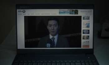 Movie still from “The Card Counter” (2021), directed by Paul Schrader – A man in a suit and tie is on a laptop screen; Extreme Close Up shot, High angle