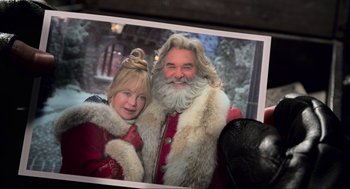 Movie still from “The Christmas Chronicles: Part Two” (2020), directed by Chris Columbus – A man and a woman dressed as santa claus; Extreme Close Up shot, High angle