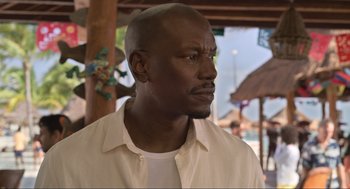 Movie still from “The Christmas Chronicles: Part Two” (2020), directed by Chris Columbus – A person wearing a white shirt; Close Up shot, Low angle