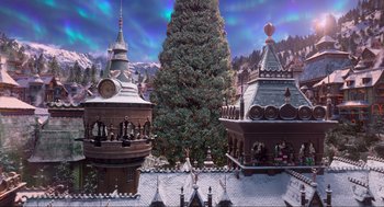 Movie still from “The Christmas Chronicles: Part Two” (2020), directed by Chris Columbus – An animated christmas tree with a large tree in the middle of it; Extreme Wide shot, High angle