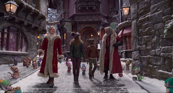 Movie still from “The Christmas Chronicles: Part Two” (2020), directed by Chris Columbus – A group of people walking down a street; Wide shot, Low angle