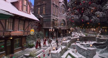 Movie still from “The Christmas Chronicles: Part Two” (2020), directed by Chris Columbus – A christmas scene of a town with people walking around it; Extreme Wide shot, High angle