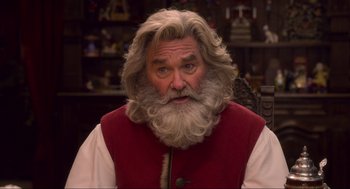 Movie still from “The Christmas Chronicles: Part Two” (2020), directed by Chris Columbus – A person with a beard; Close Up shot, Over the shoulder angle