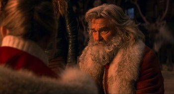 Movie still from “The Christmas Chronicles: Part Two” (2020), directed by Chris Columbus – An old man with long white hair and a long beard; Close Up shot, Over the shoulder angle