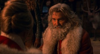 Movie still from “The Christmas Chronicles: Part Two” (2020), directed by Chris Columbus – An old man with a long white beard; Close Up shot, Over the shoulder angle