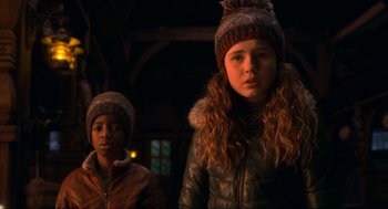 Movie still from “The Christmas Chronicles: Part Two” (2020), directed by Chris Columbus – Two young children wearing winter coats and hats; Close Up shot, Low angle