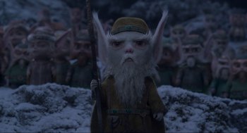 Movie still from “The Christmas Chronicles: Part Two” (2020), directed by Chris Columbus – An image of an elf character in the snow; Medium shot, Low angle