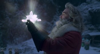 Movie still from “The Christmas Chronicles: Part Two” (2020), directed by Chris Columbus – An old man holding a crystal in his hand; Close Up shot, Low angle