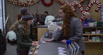 Movie still from “The Christmas Chronicles: Part Two” (2020), directed by Chris Columbus – A woman in a gray jacket and a woman in a gray jacket and a woman in a gray jacket and a woman in a gray jacket; Medium shot, Over the shoulder angle