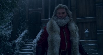 Movie still from “The Christmas Chronicles: Part Two” (2020), directed by Chris Columbus – A man with a long beard and a fur coat; Close Up shot, Low angle