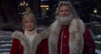 Movie still from “The Christmas Chronicles: Part Two” (2020), directed by Chris Columbus – A man and a woman dressed as santa claus; Medium shot, Over the shoulder angle